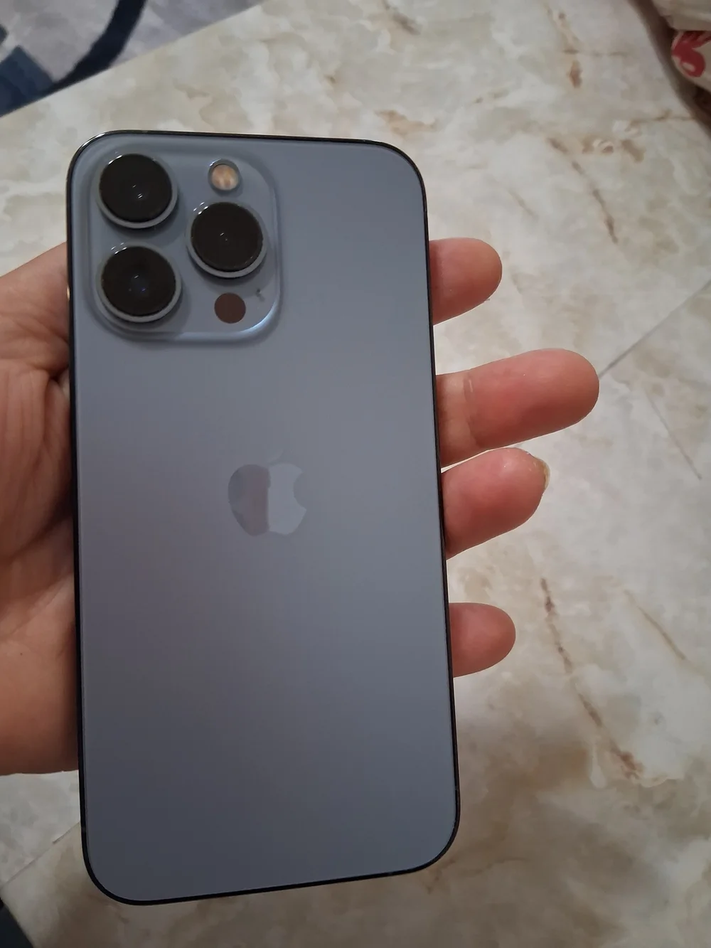 Apple Black Smartphone with Blue-Green Display